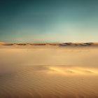 Surreal image: Large hourglass with clock face in desert setting