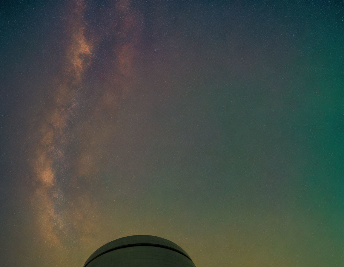 Starry Night Sky with Milky Way Over Dome-Shaped Silhouette