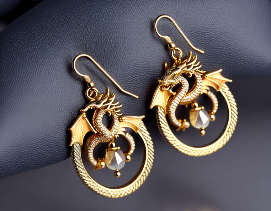 Intricate Gold Dragon Earrings with Dangling Crystal