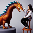 Smiling woman with realistic dragon model on stool