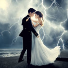 Formal attire couple embraces on beach under stormy sky