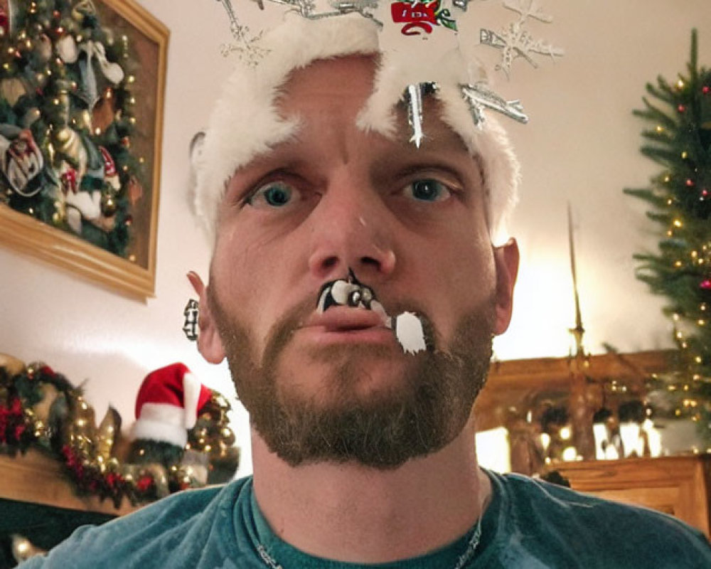 Man with snowflake beard decoration, Santa hat, chain necklace, Christmas tree backdrop