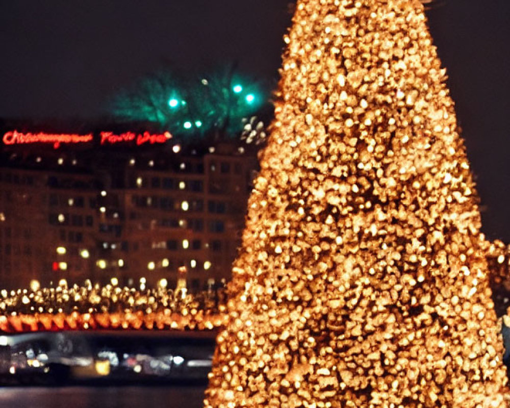 Snowy Christmas tree with golden lights against night cityscape