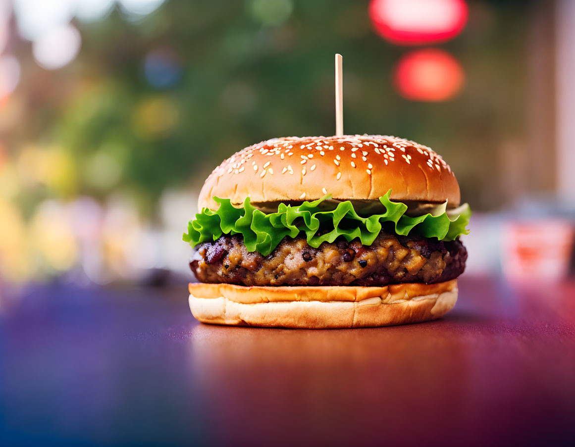 Sesame Seed Bun Burger with Lettuce on Colorful Background