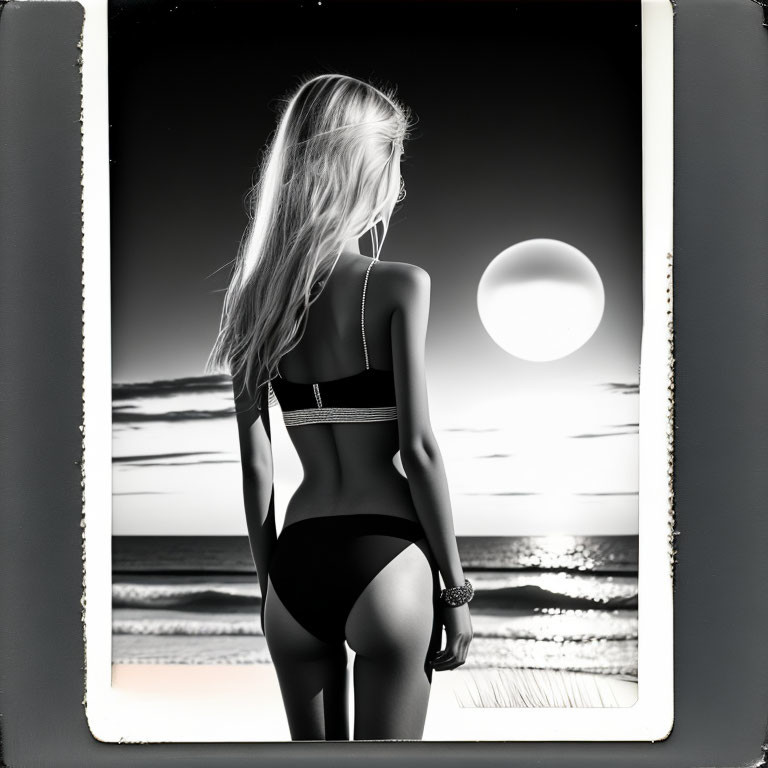 Monochrome image: Woman in swimwear gazing at sea at sunset