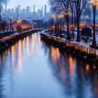 Frozen urban canal at twilight with street lamps, bare trees, and city skyline.