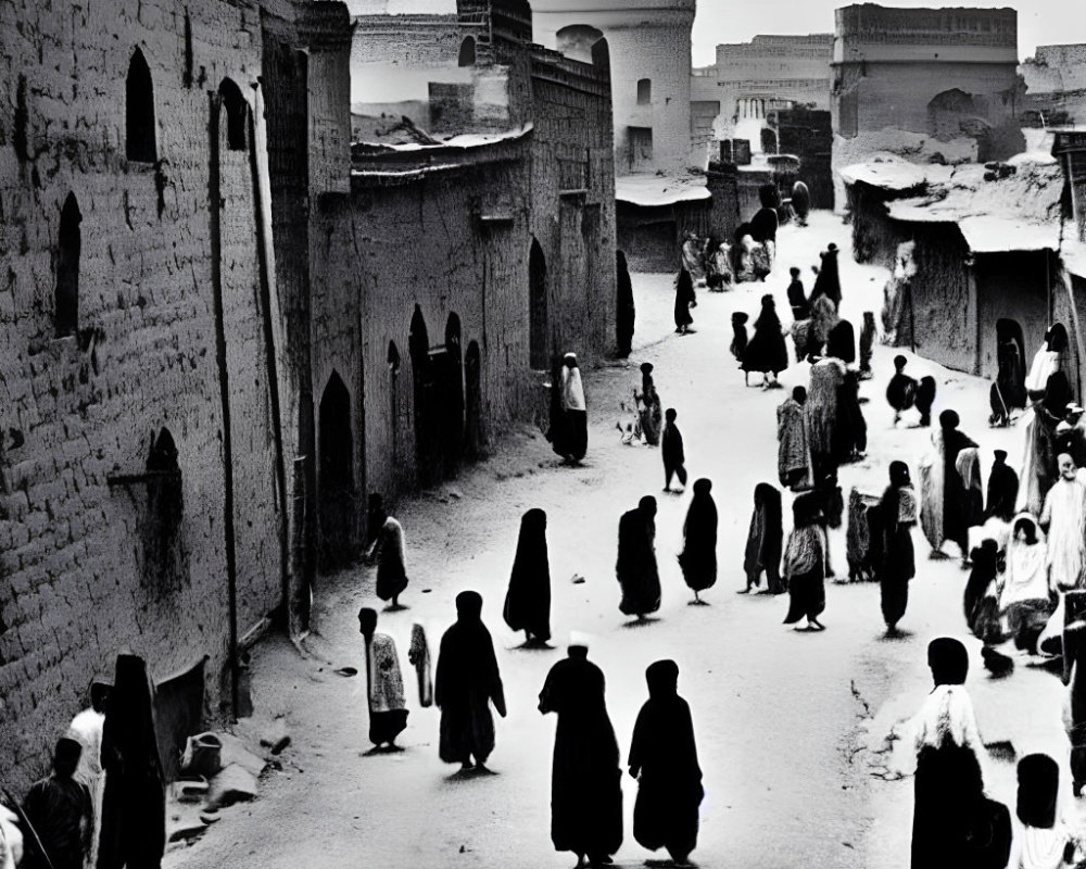 Monochrome image of people in historic street with traditional architecture