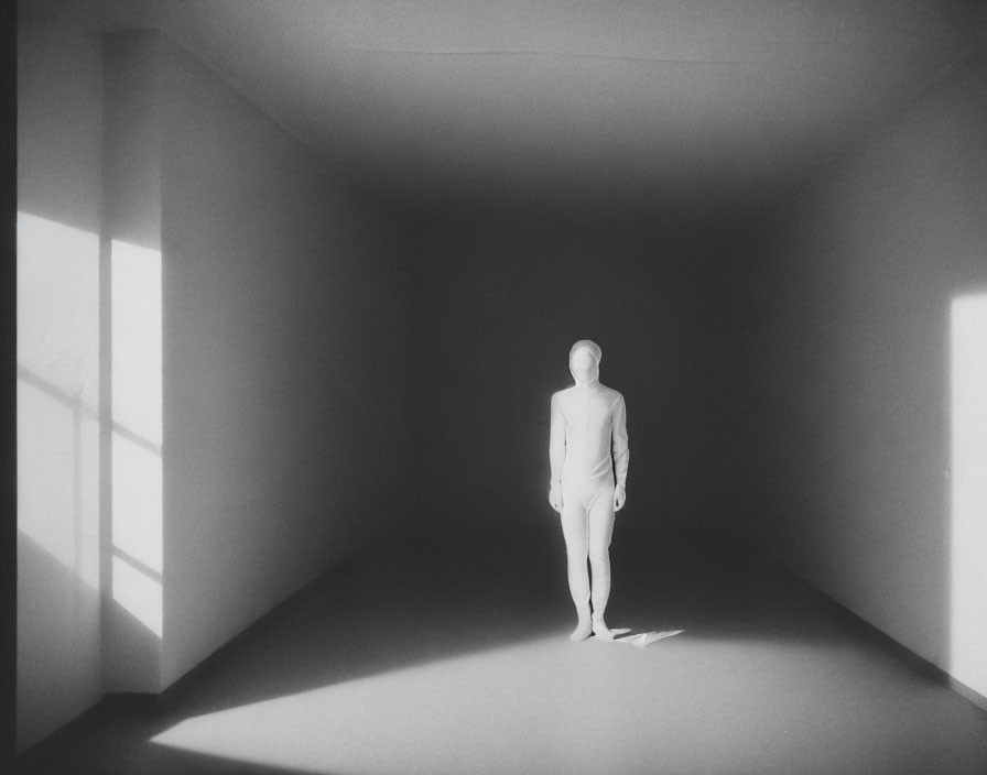 Humanoid figure in minimalist room with sharp shadows