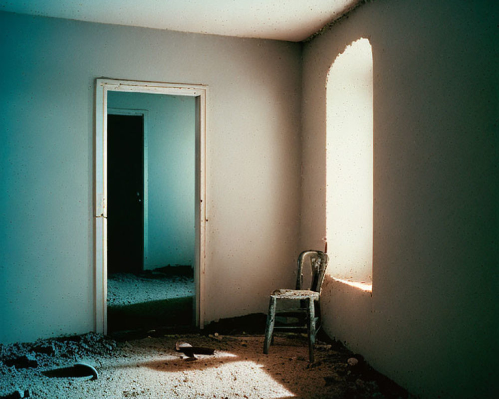 Abandoned room with peeling paint, chair, sunlight contrast