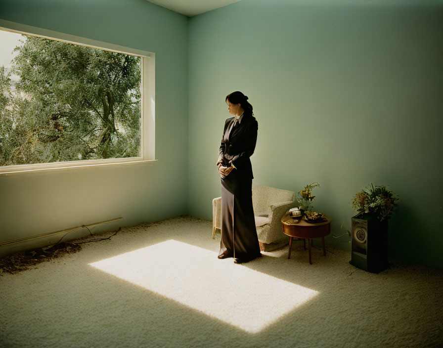 Person in sunlit blue room with plant and chair by window