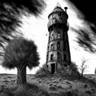 Abandoned lighthouse in windswept field with barren tree under dramatic sky