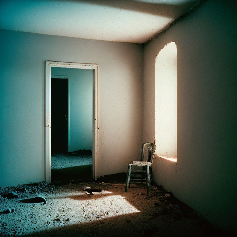 Abandoned room with peeling paint, chair, sunlight contrast