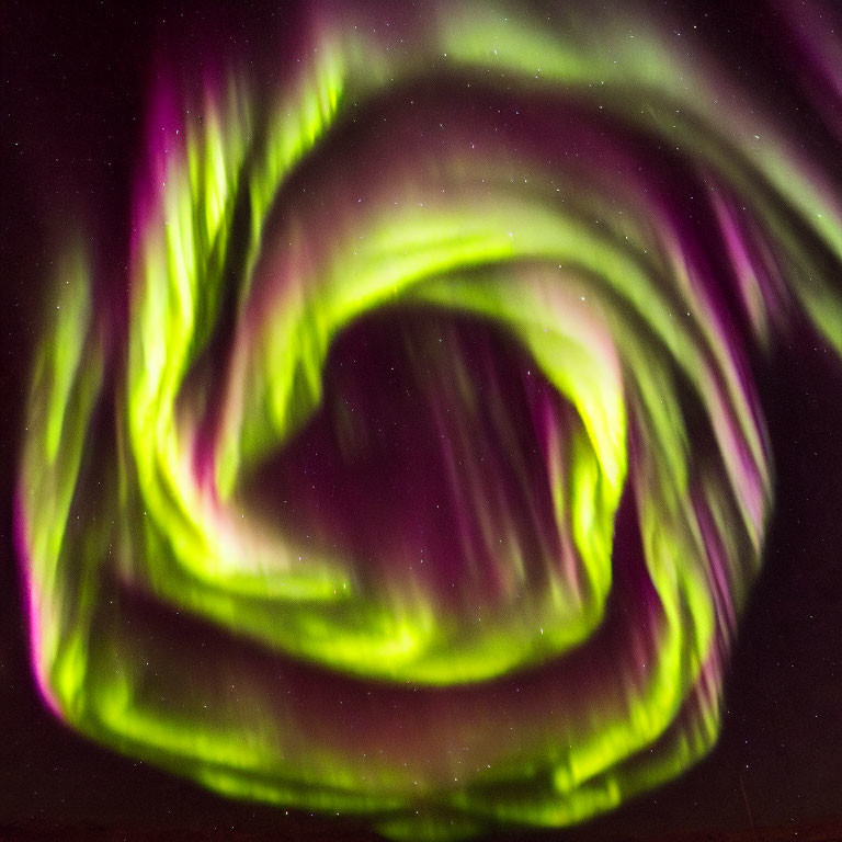 Vibrant Green and Purple Aurora Swirls in Night Sky