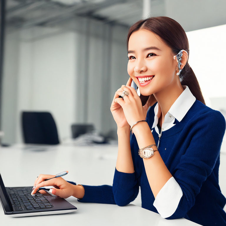 Smiling woman in blue sweater with earpiece and pen in office scene