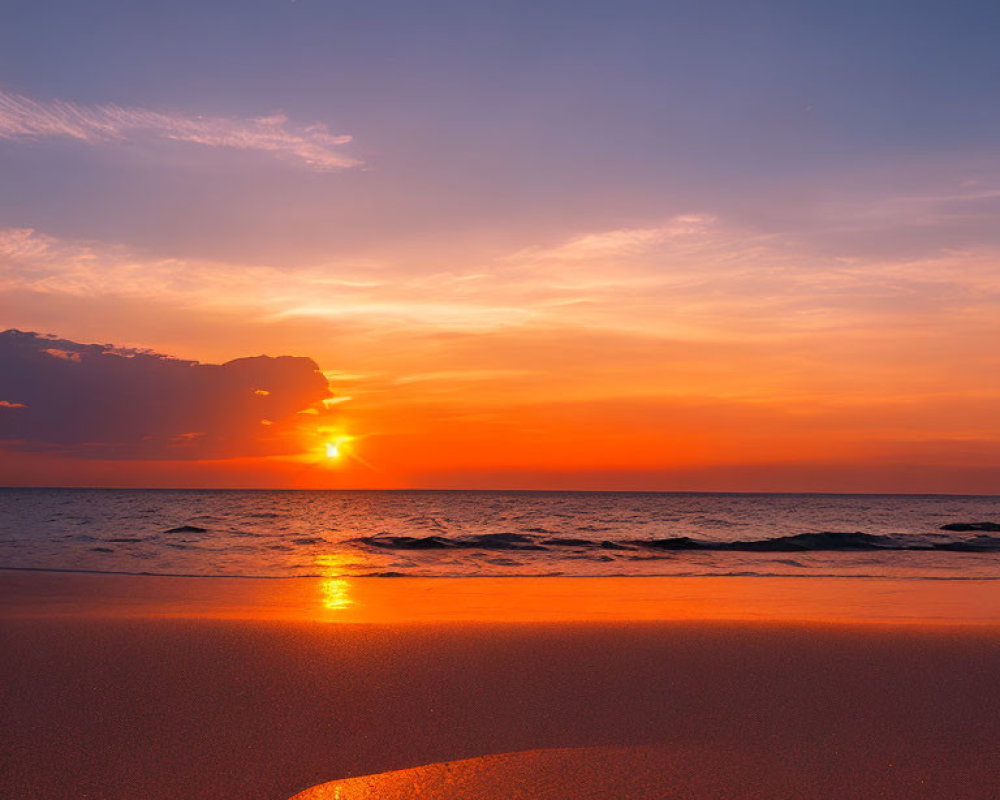 Scenic ocean sunset with sun behind clouds casting warm glow