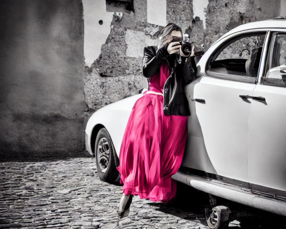 Person in Pink Skirt Takes Photo by Vintage Camera near Classic White Car