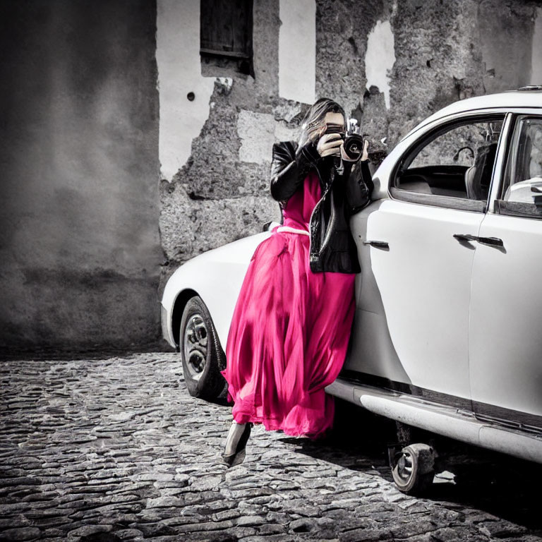 Person in Pink Skirt Takes Photo by Vintage Camera near Classic White Car