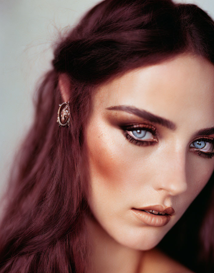 Portrait of Woman with Striking Blue Eyes and Braided Hair