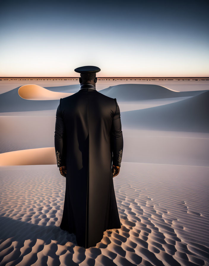 Person in elegant suit overlooking vast sand dunes at dawn or dusk