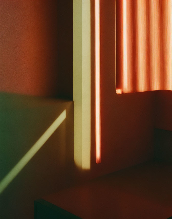 Sunlight through vertical blinds creates shadows on peach walls.