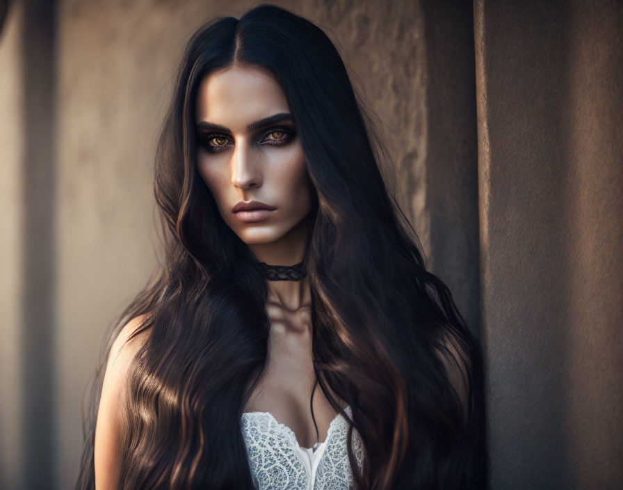 Dark-haired woman in lace top and choker against blurred backdrop