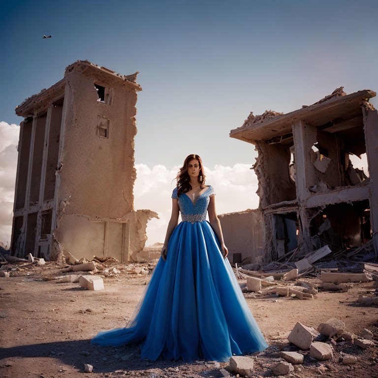 Woman in elegant blue gown amidst ruins with bird flying in distance