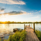 Tranquil Sunset Scene: Lake, Jetty, Flowers, Trees, Birds, Colorful Sky