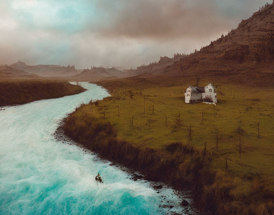 Tranquil landscape with turquoise river, green fields, and solitary house under overcast sky