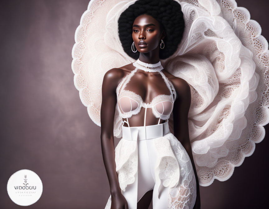 Dark-skinned model in white avant-garde outfit with lace details on purple background