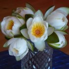 White and Cream Roses Arrangement with Purple Bud on Amber Background