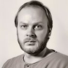 Sepia-Toned Portrait of Man with Beard and Henley Shirt