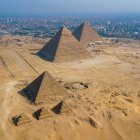 Panoramic view: Great Pyramids of Giza at sunset