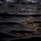 Liquid Drop Creating Ripples on Cracked Black Surface