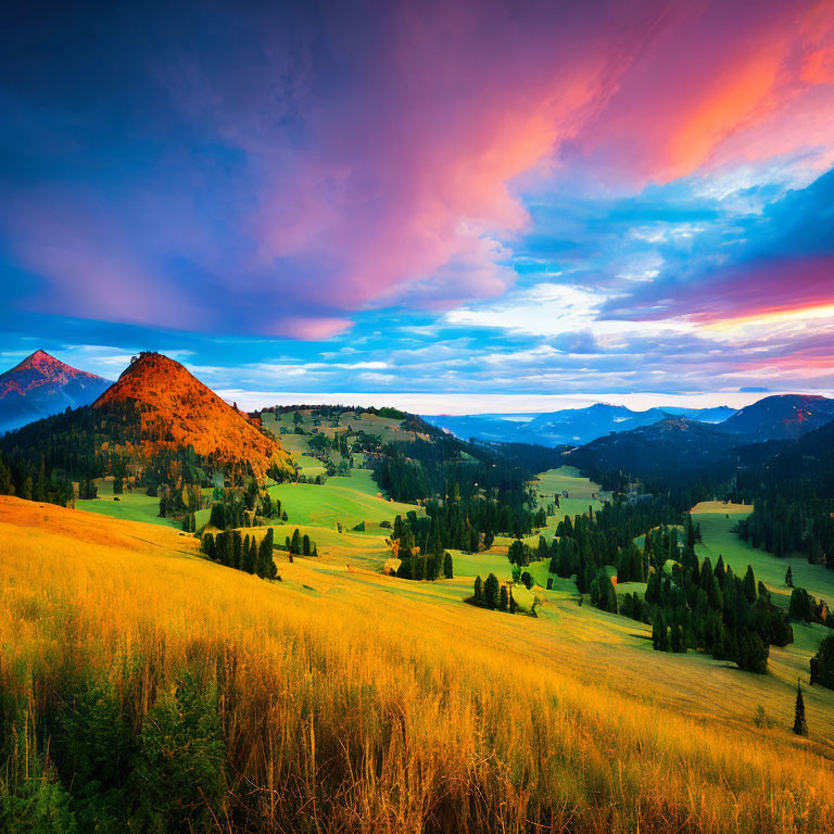 Colorful sunset over mountainous landscape with blue skies, pink and orange clouds