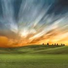 Tranquil landscape painting of rolling green hills under dramatic sunset sky