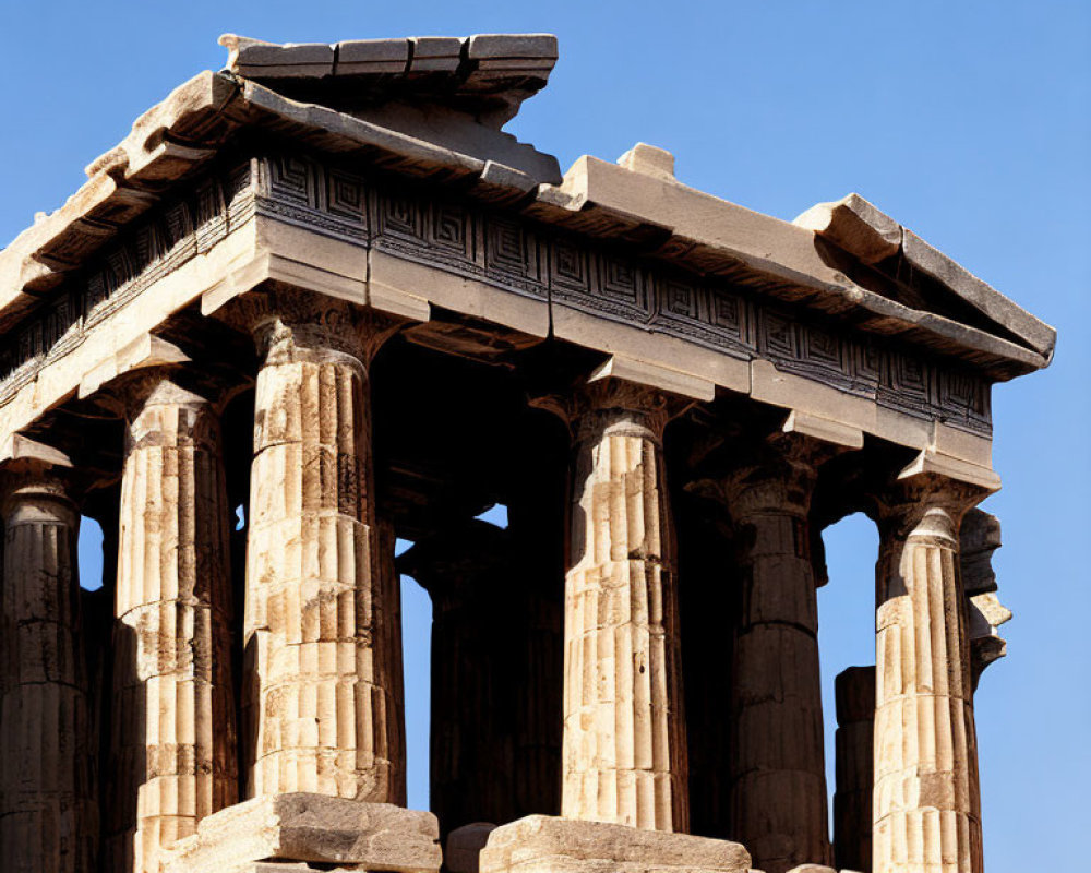 Ancient Greek Temple Ruins with Doric Columns on Clear Blue Sky