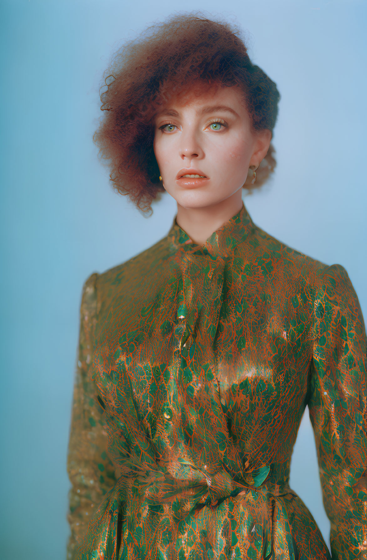 Woman with Curly Hair in Green Dress on Blue Background