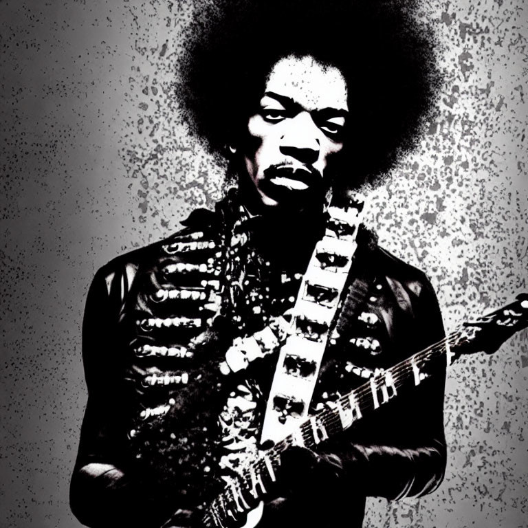 Monochrome image of man with afro holding guitar