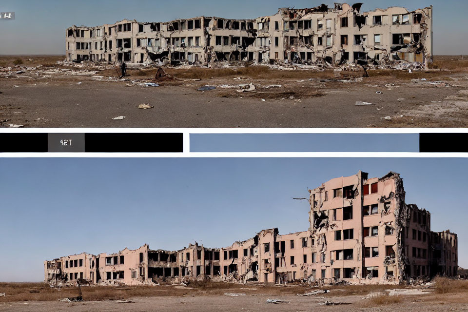 Dilapidated multi-story building with severe structural damage in barren landscape