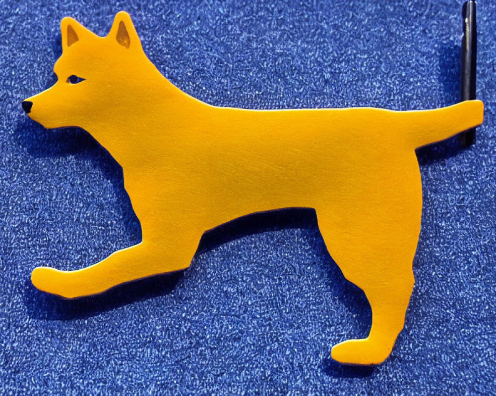 Yellow Dog Silhouette with Pen on Blue Textured Background