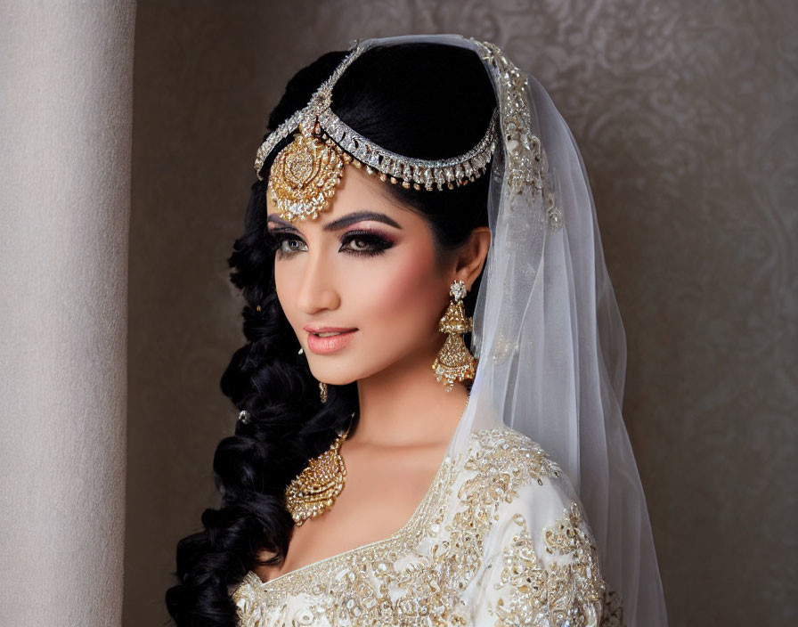 Traditional Bridal Attire with Elaborate Gold Jewelry and Detailed Headpiece