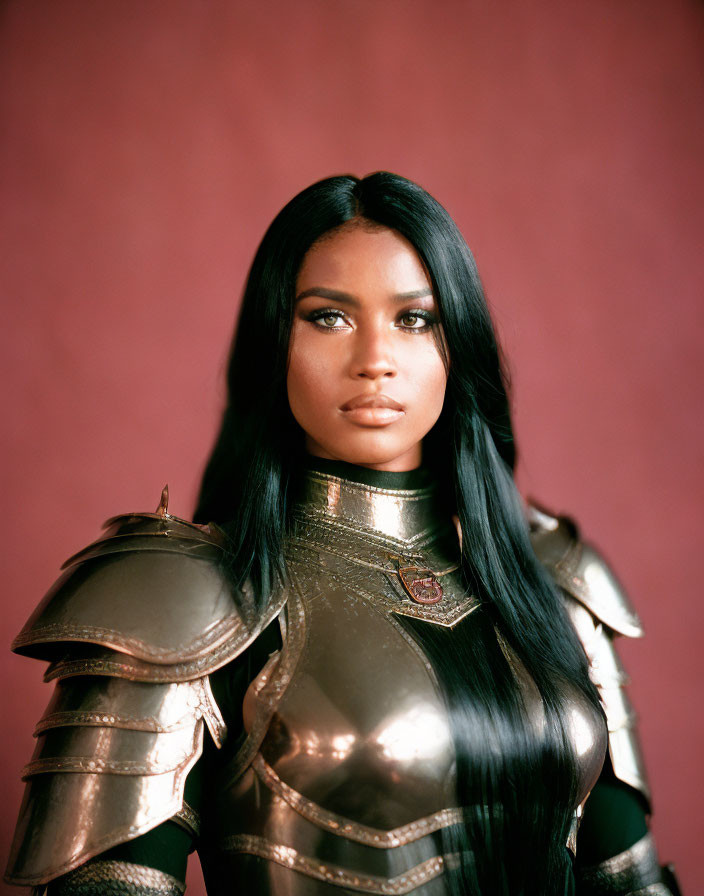 Medieval armored woman with solemn expression on red backdrop