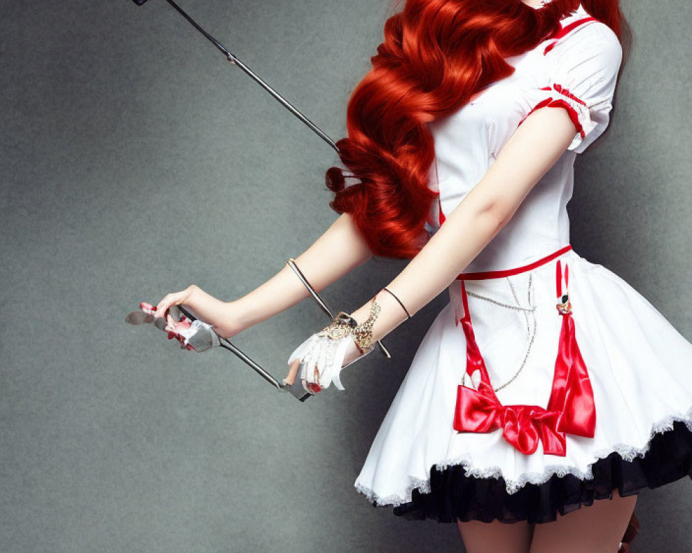 Vibrant red-haired woman in nurse-inspired outfit with large syringe prop