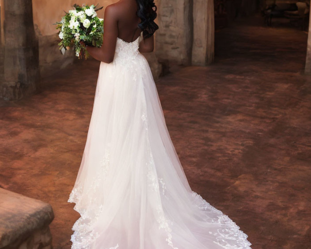 Elegant bride in white lace dress with bouquet in vintage setting