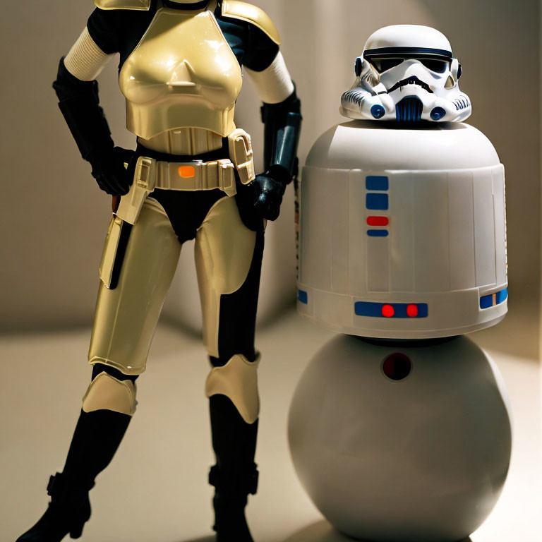 White and Gold Armored Figure with Stormtrooper Helmet Beside White and Blue R2-D2