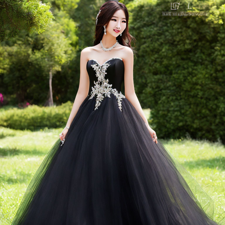 Elegant woman in black strapless ball gown with silver embellishment in lush garden