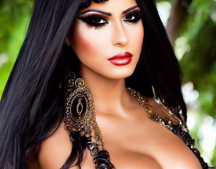 Woman with Long Black Hair and Dramatic Makeup in Nature-Inspired Setting