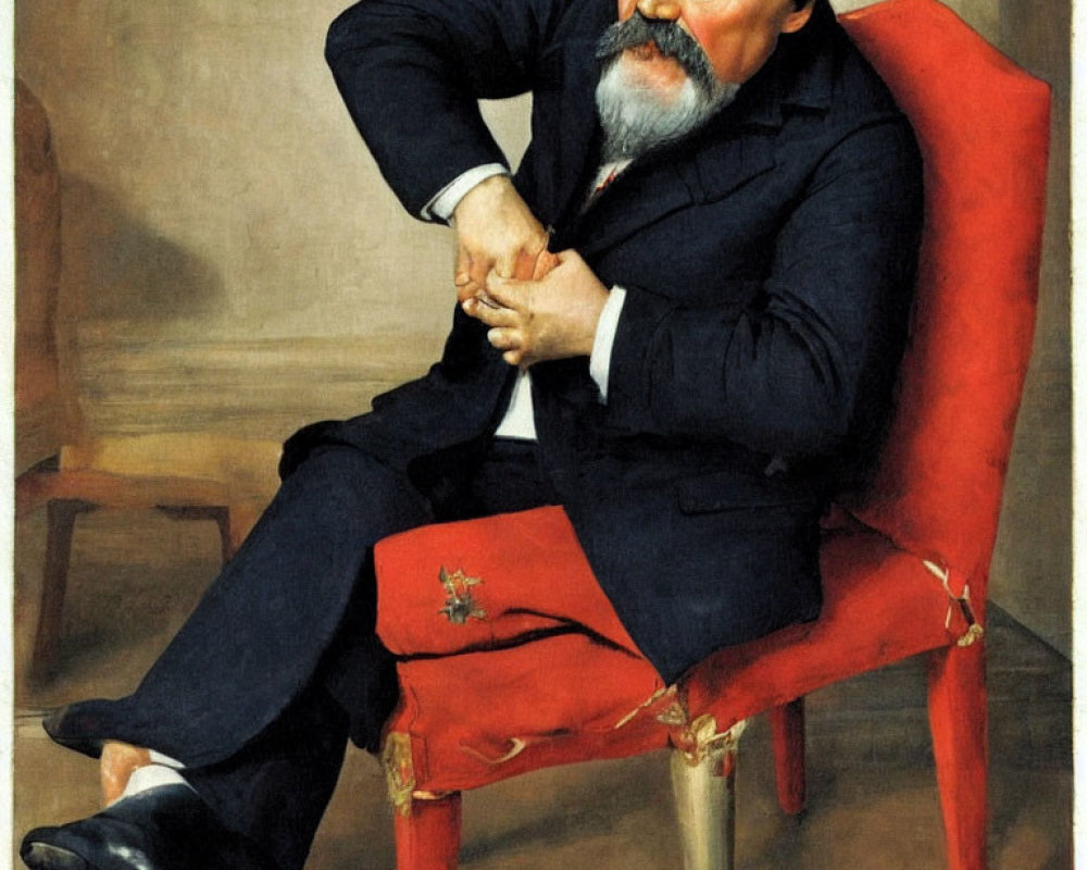 Portrait of Bearded Man in Red Chair with Crossed Arms