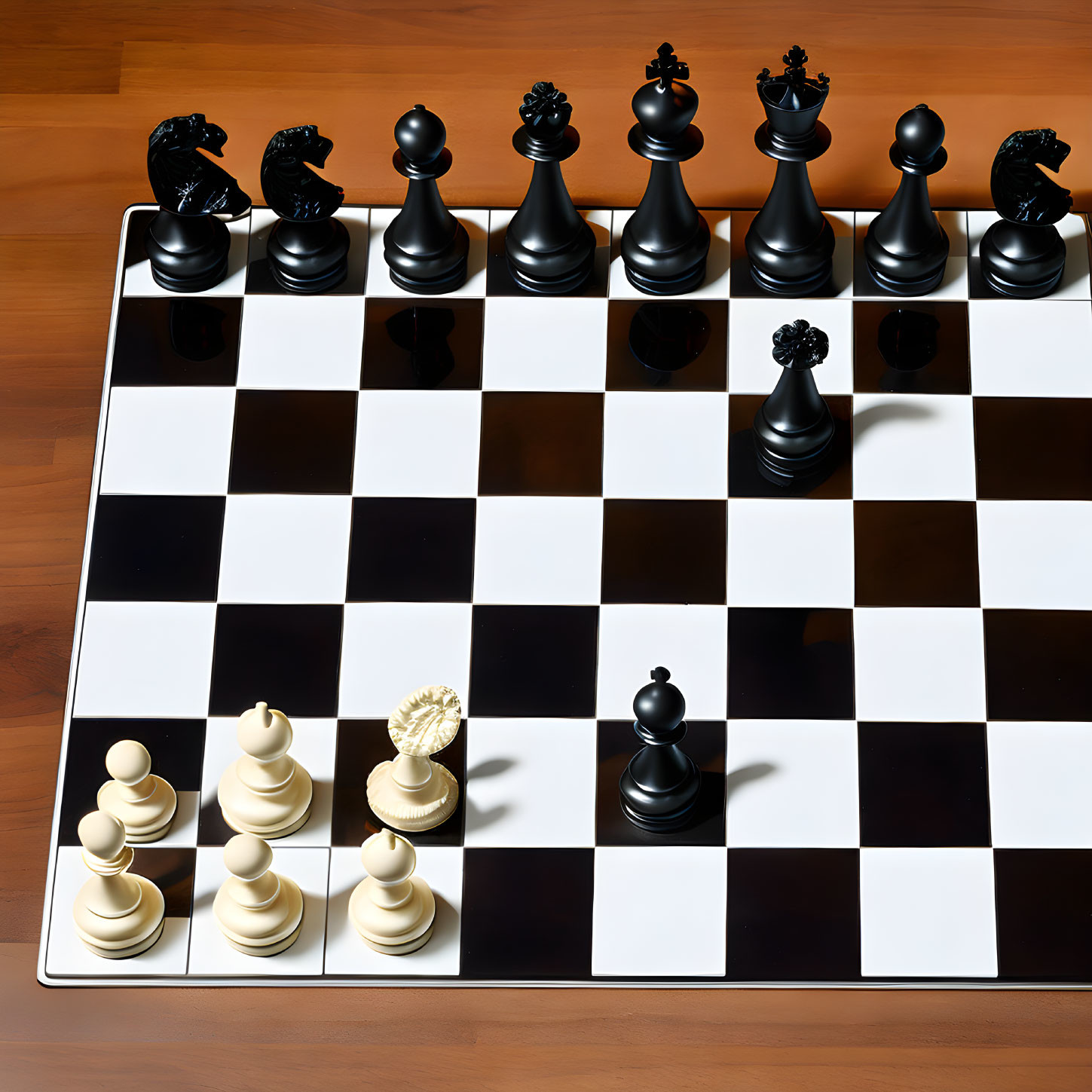 Chessboard with white and black pieces on wooden surface