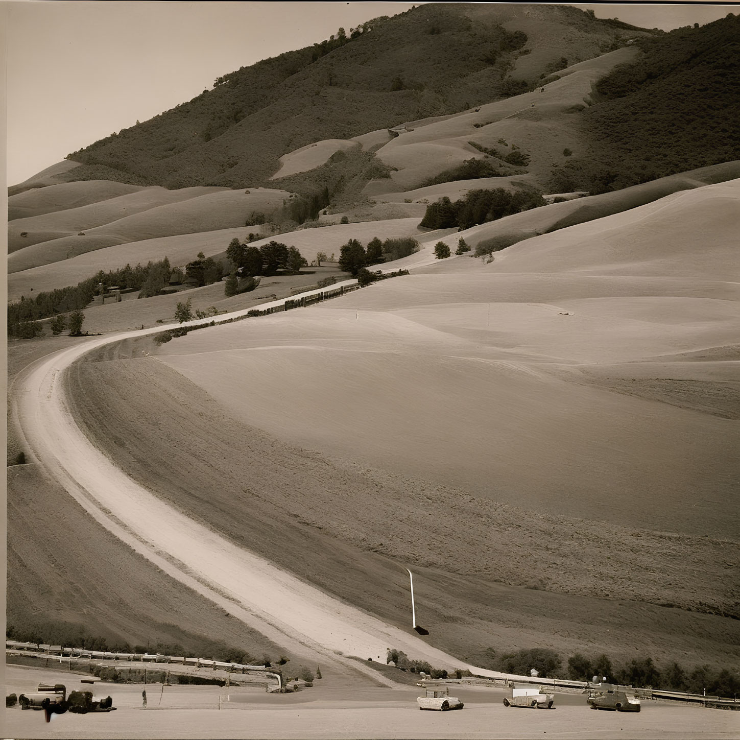 Sepia-Toned Image of Rolling Hills with Winding Road